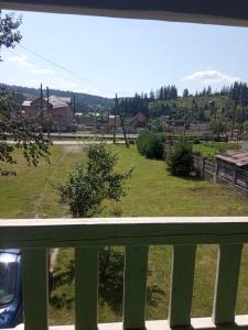 a view of a field from a balcony at MODEST in Slavske