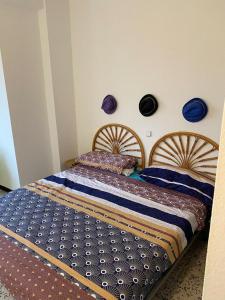 a bedroom with two beds with blue comforter at Teobaldo Power in Puerto de la Cruz