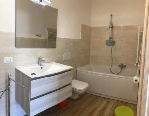 a bathroom with a sink and a tub and a toilet at Agape in Caprino Veronese +113 photos