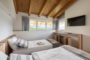 Postel nebo postele na pokoji v ubytování Agritur Deromedi