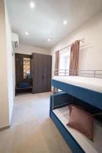 Postel nebo postele na pokoji v ubytování NUMISIA Guest House