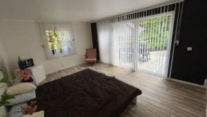 a living room with a large sliding glass door at Stuga paradis in Orkelljunga