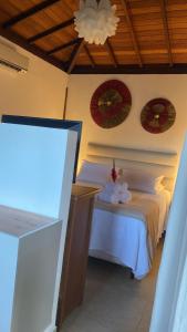Katil atau katil-katil dalam bilik di Pousada Bambu Dourado