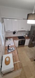 a small kitchen with a toilet in the middle at Dimitra House Madouki Corfu in Mantoúkion