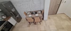 an overhead view of a kitchen with a table and chairs at Dimitra House Madouki Corfu in Mantoúkion