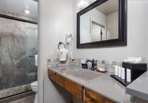a bathroom with a sink and a mirror at Sky Ranch Lodge in Sedona