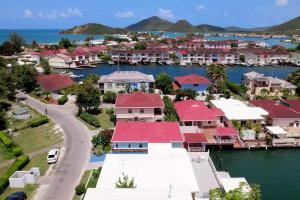 an aerial view of a resort with a marina at Attractive 3-Bedroom Home - Harbour Breeze in Jolly Harbour