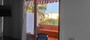 a sliding glass door with a view of a patio at Vivienda Ida - Costa Del Silencio Tenerife in Costa Del Silencio