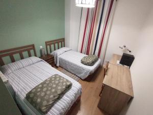 Postel nebo postele na pokoji v ubytování Amplio apartamento en Sabiñánigo - Las Margas Pirineo Aragones