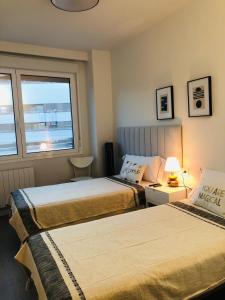 Cama o camas de una habitación en Habitación con baño privado Bilbao