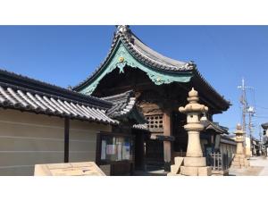 a building with a pagoda with a fountain in front at Sunrise Inn - Vacation STAY 75398v in Kaizuka