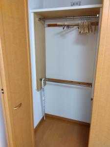 a room with a closet with a door and a door at Restful Tsukuda - Vacation STAY 14829 in Aomori