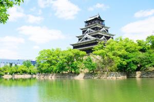 a pagoda in the middle of a lake at Urban Grace Hiroshima 1301 - Vacation STAY 14847 in Hiroshima