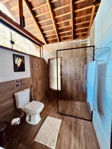 a bathroom with a toilet and a shower at Cirandeira Amazon World EcoResort in Manacapuru