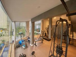 a gym with several exercise equipment in a room at Navega Beach Palace Hotel in Navegantes