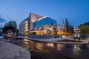 a large building on a city street at night at Apartel Uzhhorod in Uzhhorod