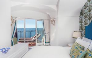 Letto o letti in una camera di Il San Pietro di Positano
