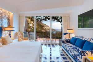 Letto o letti in una camera di Il San Pietro di Positano
