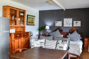 a living room with a couch and a table at The Knoll Historic Guest Farm in Hilton