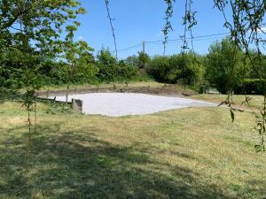 a large circle of sand in the middle of a field at Maison de campagne moderne in Beaurieux