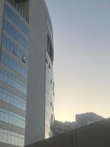 a tall building with a lot of windows on it at Apartment City Center Hilton Tanger in Tangier