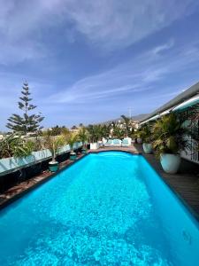 a swimming pool on the roof of a building at Tropical Villa in Adeje