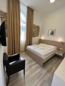 Postel nebo postele na pokoji v ubytování Minella Residence