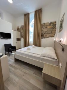 Postel nebo postele na pokoji v ubytování Minella Residence