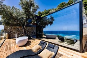 a bathroom with a view of the ocean at Baba Residences in Alassio