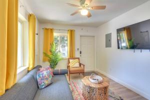 a living room with a couch and a ceiling fan at Beautiful Casita with King Bed and private patio Close to Calle 8, MIA Airport, Coral Gables in Miami