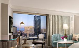 a hotel room with a view of a city at Bellagio in Las Vegas