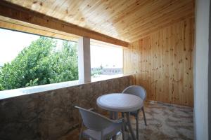 a room with a table and chairs and a window at WHITE HOTEL GYUMRI in Gyumri