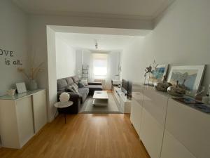 a living room with a couch and a table at Apartamento Lea in Bilbao