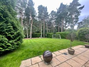 a garden with a soccer ball in the grass at Four bedroom entire luxury house in wynyard with free wi-fi, Parking and lots more 