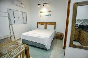 Cama ou camas em um quarto em Flats de Sumatra mais 37 fotos