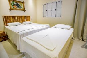 Cama ou camas em um quarto em Flats de Sumatra