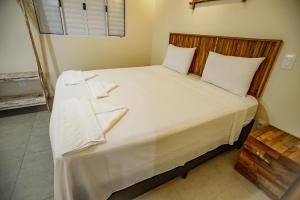 Cama ou camas em um quarto em Flats de Sumatra