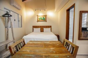 Cama ou camas em um quarto em Flats de Sumatra
