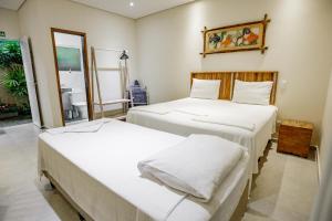 Cama ou camas em um quarto em Flats de Sumatra