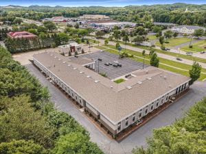 an overhead view of a building with a parking lot at Baymont by Wyndham Grand Haven in Grand Haven