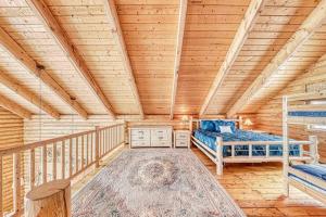 a bedroom with a bed and a wooden ceiling at Spectacular Chalet overlooking the ski slopes in Brian Head