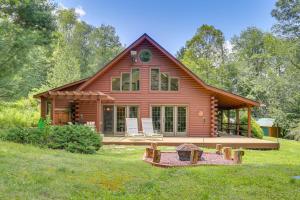 a log cabin with a porch and a yard at Milanville Cabin with Fire Pit, 1 Mi to River! 