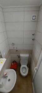 a small bathroom with a toilet and a sink at KULIC in Plužine