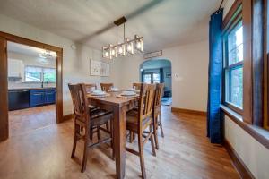 a dining room with a wooden table and chairs at Central Erie Vacation Rental about 2 Mi to Beach! in Erie