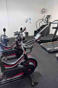 a gym with several exercise bikes in a room at Modern Holiday Home in Wick +2 photos