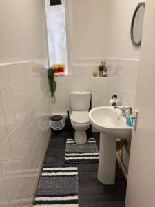 a bathroom with a toilet and a sink at Central London location, close to bars restaurants and train stations in London