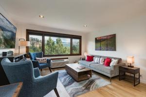 a living room with a couch and two chairs at Tamarron Lodge Studio - 103 in Durango