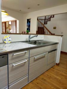 a kitchen with a sink and a counter at Guest house with host Takao SORA- Vacation STAY 13000 in Hachioji