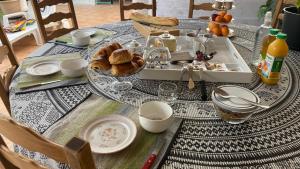 a table with a tray of food on top of it at Maison quiétude in Chavanoz
