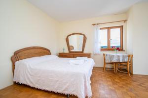 Postel nebo postele na pokoji v ubytování Studio Mrljane 327b